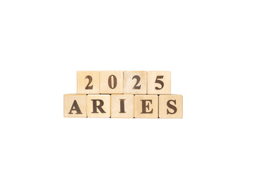 Aries zodiac sign word in wooden cubes. White background. Set of astrology symbols. Horoscope 2025...