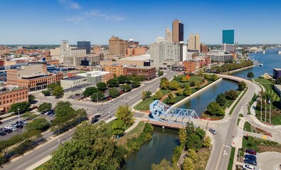 High-angle view of downtown Toledo, Ohio. Cityscape, parks, and a canal. Beautiful day. DOWNTOWN,...
