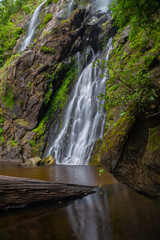 Fototapeta premium Khlong Lan Waterfall is one of the most beautiful and grand waterfalls in Thailand. The area above the cliff of the waterfall is a wide plain. Below the waterfall is a large pool where you can swim. 