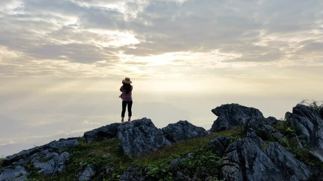 Tourist taking photography and enjoy nature panoramic landscape at Doi pha mon mountains in Chiang rai, Thailand.