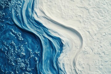 Abstract blue and white swirling paint texture.