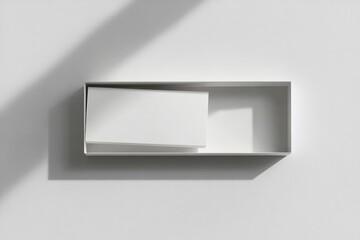 White rectangular box with inner white rectangle, minimalist design, shadow.