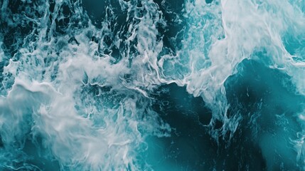 A close-up view of a single turquoise wave curling dramatically, with white foam glistening in the sunlight.