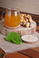 herbal drink made from turmeric, betel leaves and oak galls photographed in a studio setting with...