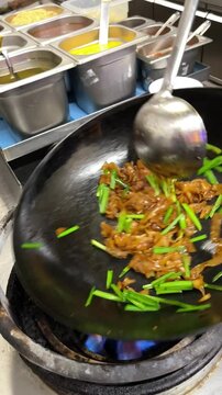 wok cooking, making Thai stir fried noodles (pad see ew)