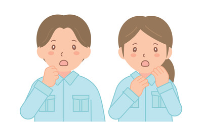 驚いた表情をする作業着の男女スタッフ（上半身）