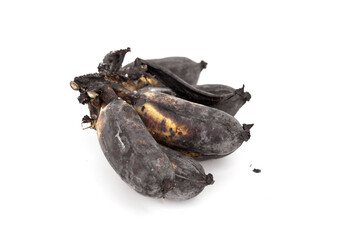 Overripe rest of the ducasse banana in the comb and starting to rot skin peel is black bruised and...
