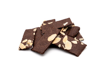 Crispy cracker snack. A pile of brittle brownie with almond nut isolated on white background.