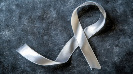 Silver ribbon awareness for World parkinson's day - symbol of support and hope. Brain dysfunction. Memory loss, degenerative disorder. Taking care of mental health. Horizontal banner. Copy space