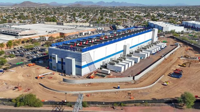 Hyperlapse drone shot of a new data center under construction in Phoenix, Arizona on a sunny day