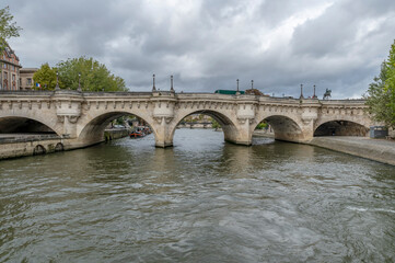 Fototapeta premium Pont Neuf is, despite its name, the oldest existing bridge in Paris, France. It crosses the Seine River.