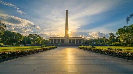 Fototapeta premium Front view of the Capas National Shrine in Tarlac, with its iconic obelisk glowing under golden sunlight, in 4K resolution