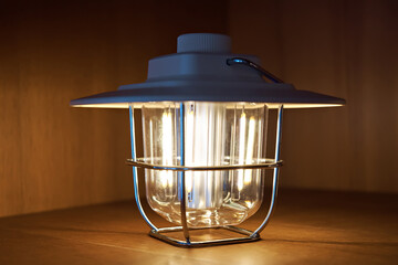 Using a battery-powered lamp. Autonomous lighting during a power outage. Ukraine