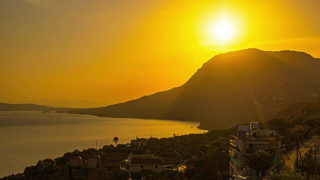 Unique sunrise time lapse over a mountain and the ocean, sea, landscape and nature at its best, copy space, few clouds, cars passing, Crete in Greece
