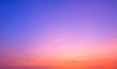 Evening romantic sky background with colorful pink orange natural gradient light and thin cloud on...