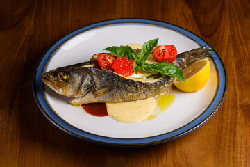 sea bass baked with vegetable gratin and feta cheese