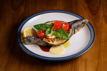 sea bass baked with vegetable gratin and feta cheese