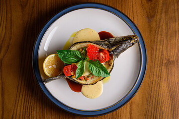 sea bass baked with vegetable gratin and feta cheese