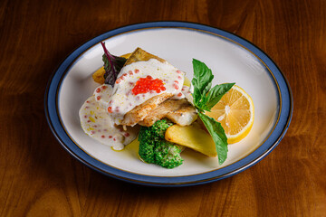 baked walleye with broccoli potatoes and caviar sauce