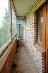 Interior of old covered balcony of residential building, loggia for renovation