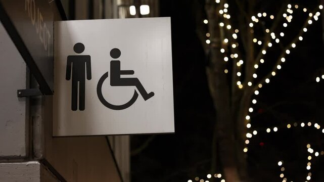 Sign for men's bathroom with accessibility 