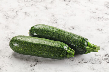 Raw green ripe zucchini vegetable