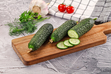 Raw green cucumbers with slices
