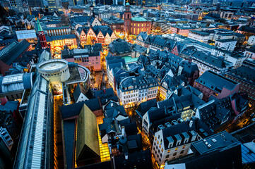 Frankfurt am Main, Germany - December 21, 2024: Evening panorama of the city centre from the Frankfurt Cathedral tower.
