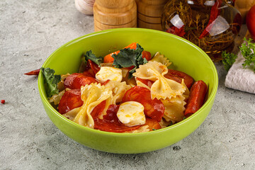 Italian pasta farfalle with pepperoni