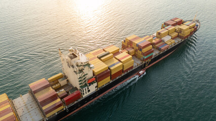 Cargo Container ship at sunset. ship carrying container and running for import export concept...