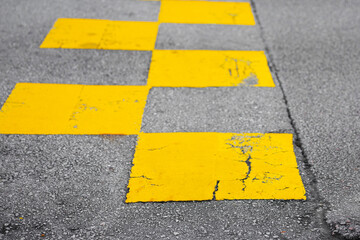 Fototapeta premium Top view. Asphalt texture road with yellow old marking line. Outdoor at daytime on summer day.