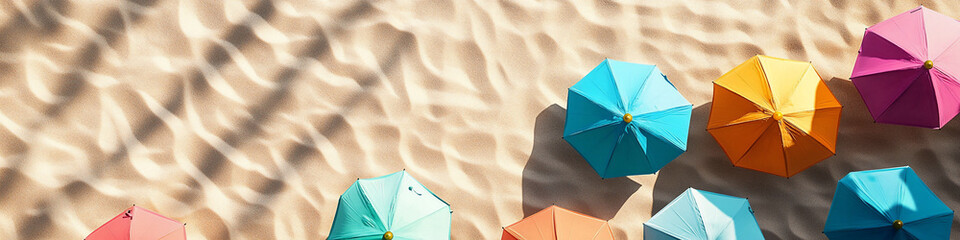 Bird's-Eye View of Colorful Umbrellas on Sandy Beach