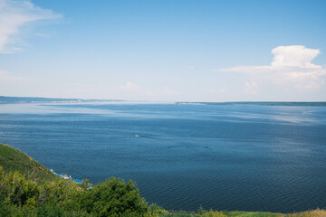 View of the Volga River in Tatarstan, Russia. Endless blue river in summer. Calm natural landscape.