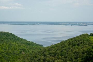 View of the Volga River in Tatarstan, Russia. Endless blue river in summer. Calm natural landscape.