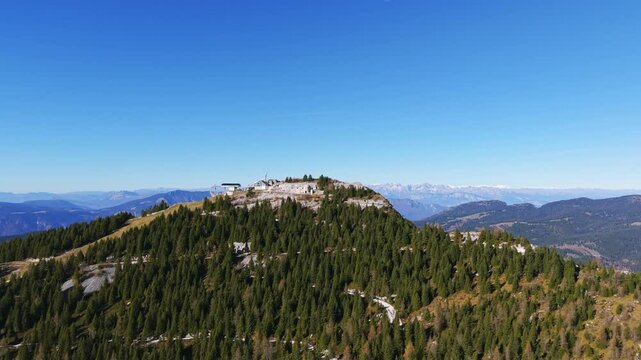 Aerial view of the summit of mount verena with forte verena, a military fortress built during world war i, surrounded by the typical fir trees of the plateau