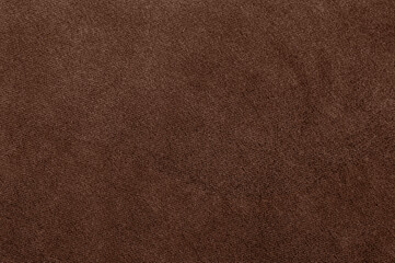 Close-up of soft velour fabric texture in Pantone 2025 color Mocha Mousse.