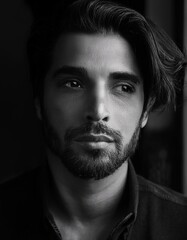 Fototapeta premium Mystery in Monochrome: A Captivating Black-and-White Portrait