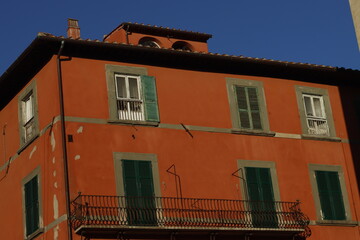 Facade of a classic building in the downtown of Pisa, Italy