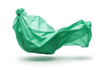 A crumpled green plastic bag floating in the air, with the material creating abstract and organic shapes against a plain white background