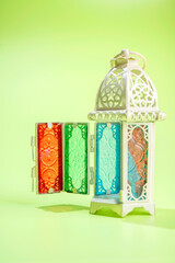 Arabic lantern on a colored background. Decoration for Muslim holidays celebration