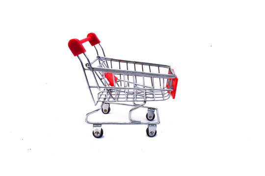 four red shop carts, Close up view of empty shopping trolley isolated on white, shopping cart side view trolley red colour on white background | E-commerce supermarket trolley side view