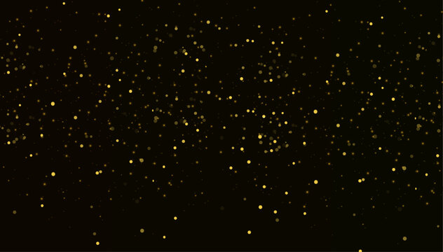 Gold glitter particles on black background