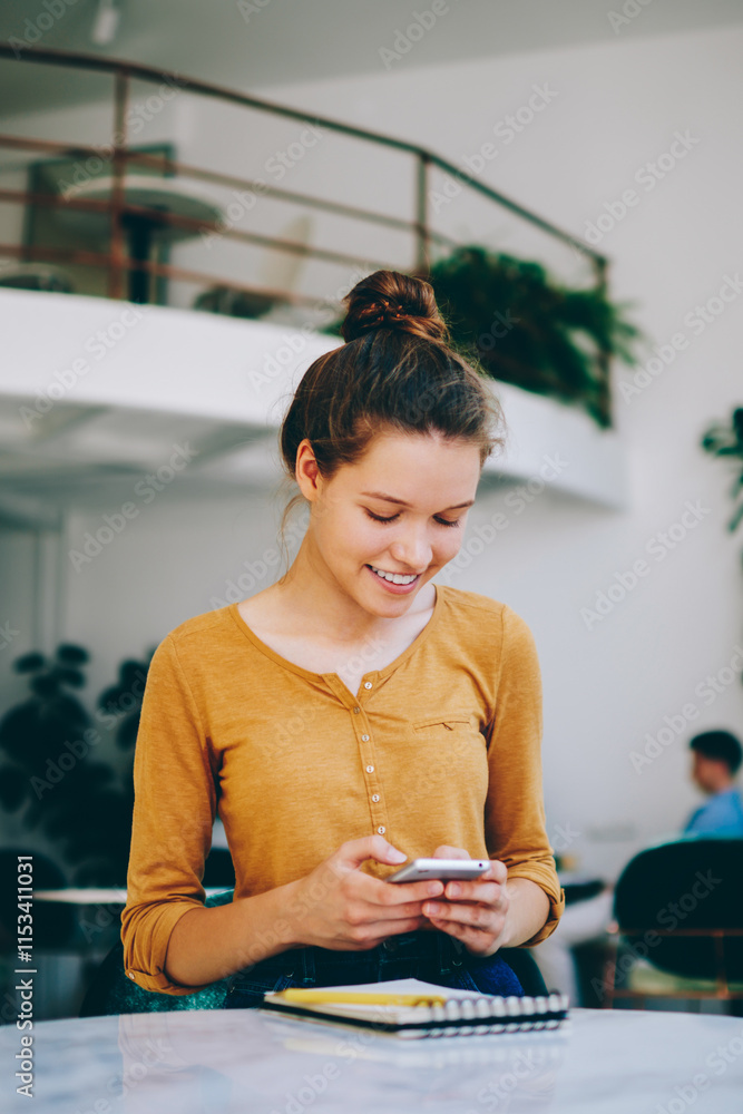 Poster cheerful smiling female blogger searching information for own content in social networks while readi