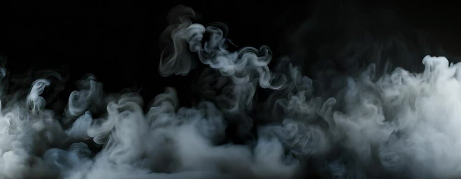 Thick white smoke billows and swirls against a black background.