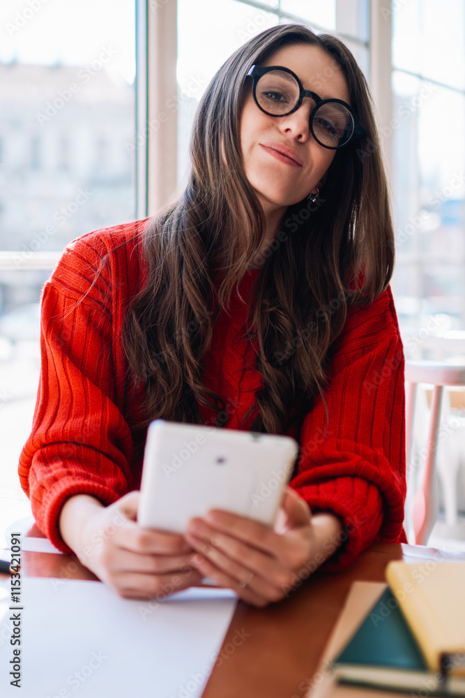 Aufkleber portrait of young smiling blogger looking in camera while waiting friend at cafeteria and creating n