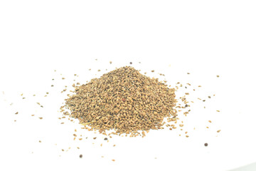 Medicinal combination of ajwain seeds in a wooden bowl with thankuni,  ajwain seeds in bag, Close-up of organic Carom seeds (Trachyspermum ammi) or Ajwain in a jute bag on a heap of Carom seeds