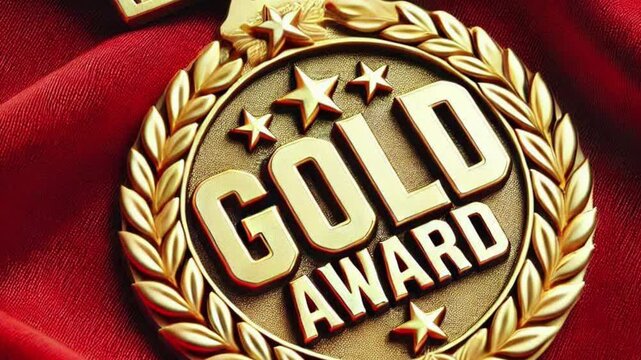 Elegant Gold Award Medal on Luxurious Red Fabric Background, Perfect for Achievement and Recognition Themes