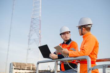 An electrical engineers are seriously planning to prepare a place to install solar panels in the office.