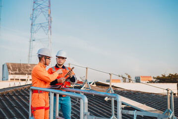 Two engineers are planning a professional solar panel installation to provide backup power to the office.