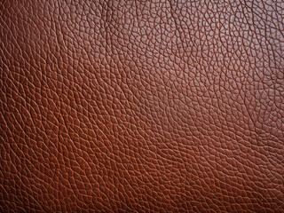 Fototapeta premium Rich brown leather texture featuring natural grain and subtle surface wrinkles